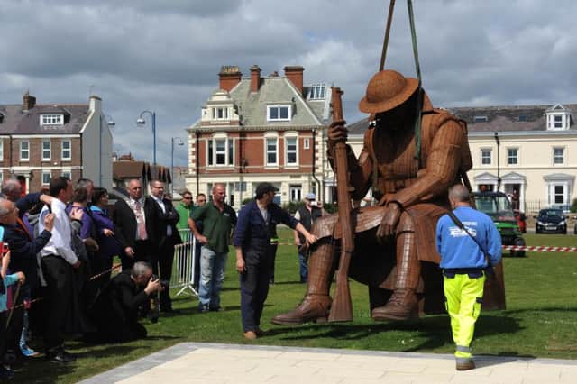 The Tommy statue is lifted into place on its permanent plinth on Seaham seafront.