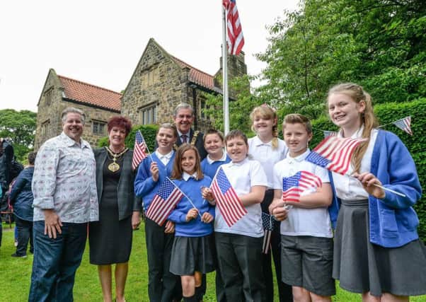 The Star Spangled Banner is raised over Washington Old Hall, the ancestral home of America's first president, as the annual 4th of July celebrations got underway this morning, organised in partnership by the National Trust, Friends of Washington Old Hall and Sunderland City Council.
Picture shows students from George Washington Primary School with Mayor and Mayoress Barry and Carol Curran and Jon Gann from Washington DC