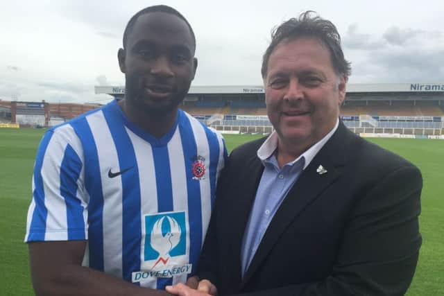 Kudus Oyenuga with chief executive Russ Green. Picture courtesy of HUFC
