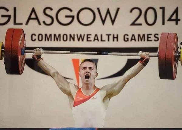 Weightlifter Shaun Clegg competes at the Commonwealth Games in Glasgow in 2014
