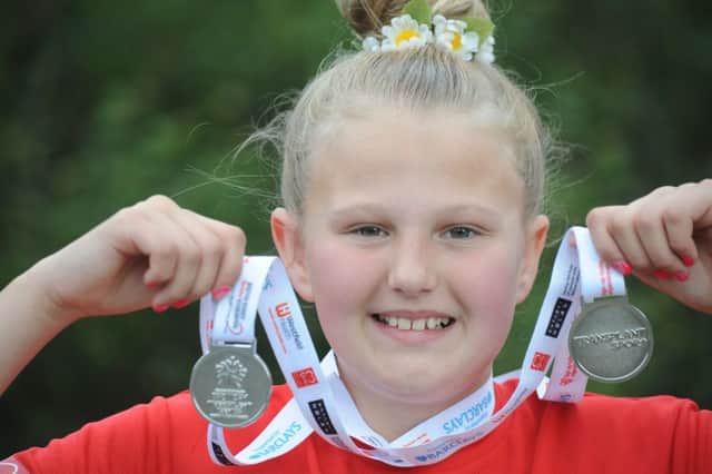 Liver transplant patient Frankie McCulloch with her two silver medals from the Transplant Games held in Newcastle.