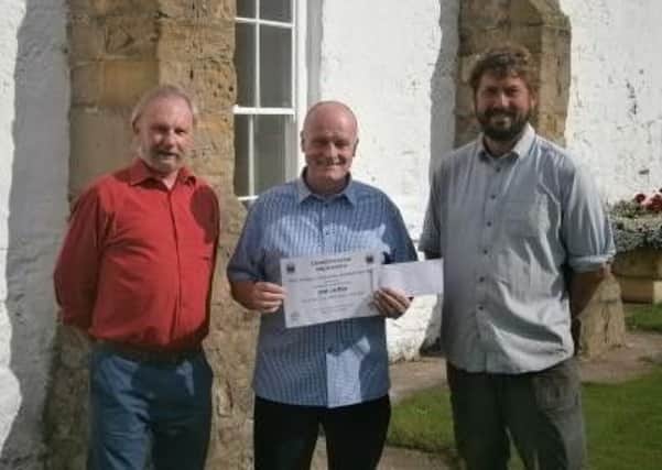 Easington Parish Council chairman Len Morton with winner Jack Lee and Ross Weightman, of Plants R Ross.