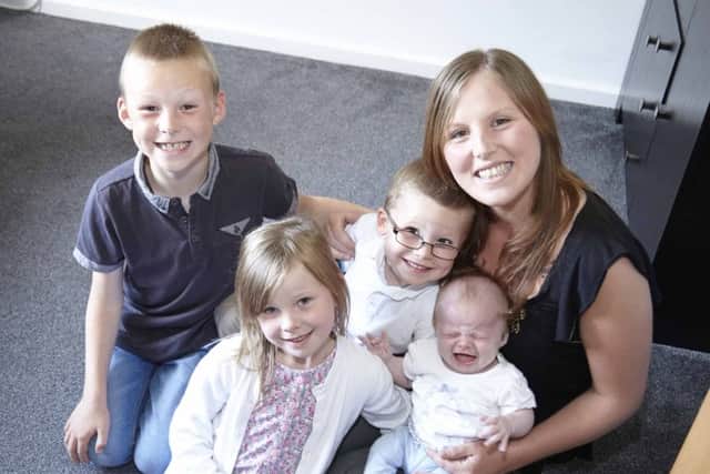 Kelly Johnson with her children Ava, 11 weeks, Alfie, four, April, six, and Daniel eight.
