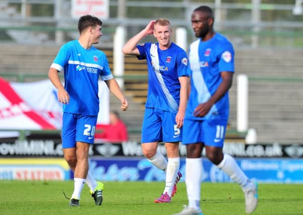Hartlepool United players (left to right) Dan Jones, Scott Harrison and Kudus Oyenuga celebrate at the end of  their 2-1 away win at Yeovil