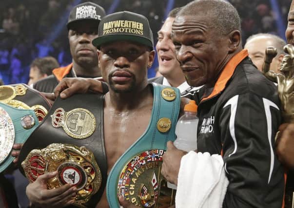 Floyd Mayweather Jr (left) with dad and trainer Floyd Mayweather Sr, after his victory over Manny Pacquiao in May