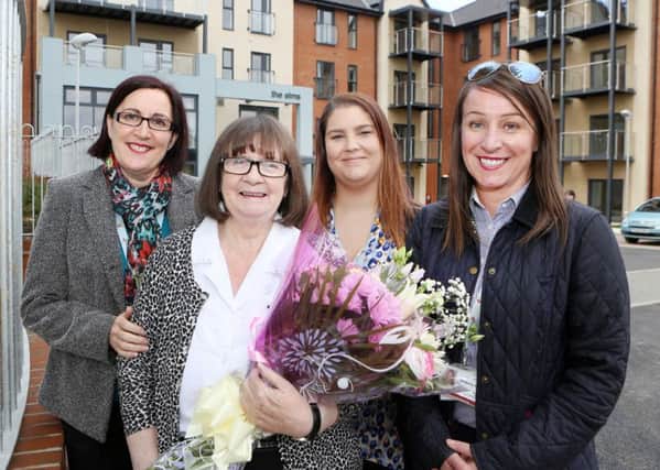 Jean Laws, centre, holding flowers, with, from left to right, scheme manager Sharon Sykes, housing officer Natalie Greener and development officer Kimberley Tye.