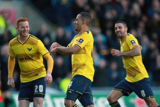 Oxford United's Kemar Roofe celebrates scoring his side's third goal during the FA Cup tie against Swansea