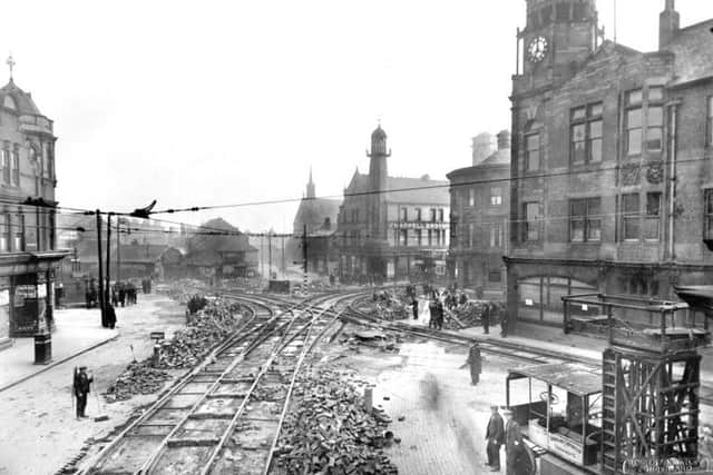 The Wheatsheaf Lighthouse is in the distance in this photo, which features work on the tram lines - possibly in the 1930s.