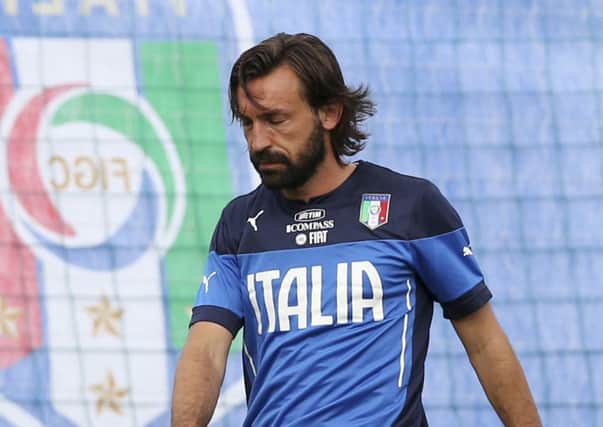 Italy midfielder Andrea Pirlo, right, and team-mate Daniele De Rossi during a training session of Italy in Brazil 2014