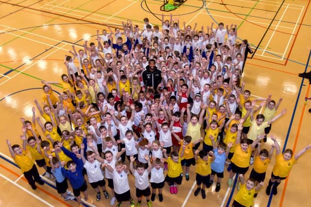 Newcastle Eagles basketball player Darius Defoe with Sunderland primary school children from Sunderland at a basketball event held at City Space, on Wednesday.