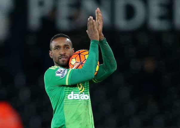 Jermain Defoe celebrates with the match ball at Swansea