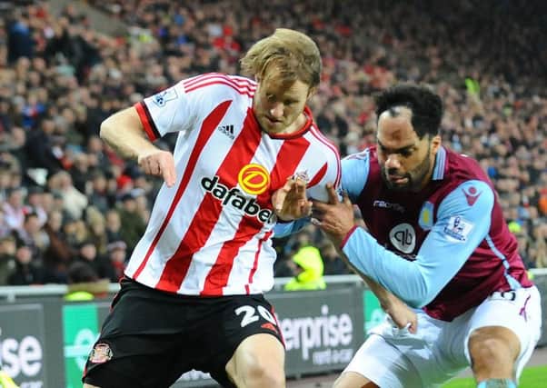 Ola Toivonen battles Joleon Lescott in Sunderland's recent win over Aston Villa