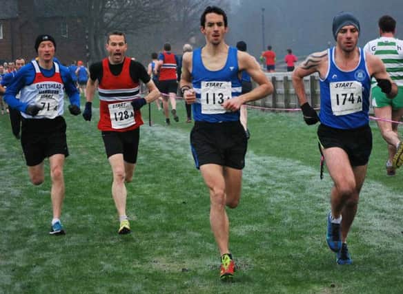 Sunderland Harrier Over-35s veteran Ian Dixon (right) runs in the first leg of the Cathedral Cross Country relay at Durham. Picture by Hudson Stoker