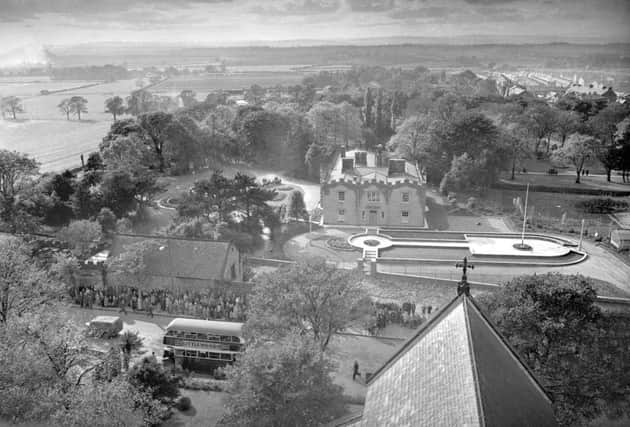 Wednesday Retro 1954 Houghton - no date  old ref number 12-1257    Wednesday Retro 1954   This striking view of Houghton Council offices (formerly the old Rectory) and grounds is from the tower of the Parish Church of St Michael's and All Angels. The picture was taken on a recent Feast Sunday when the choirboys, according to custom, sing from the tower. Note the people gathered in the grounds. One of the most notable highway improvements in the town was carried out at this point by the removal of the high wall which formerly skirted the Rectory grounds. Thursday September 30 1954 St Michaels and All Angels
