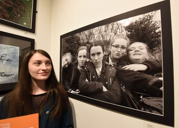 One of the Youth Arts Exhibition winners, Lilly Thompson, with her work, at Washington Arts Centre.
