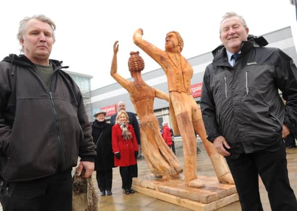 The new wood carving of Lord and Lady Bryon outside of Seaham's Bryon Place shopping centre, unvielled by artist David Gross, left, leader of Seaham Town Council Eddie Bell, with Mariann Oliver, Carol Hindmarch and John Brady.