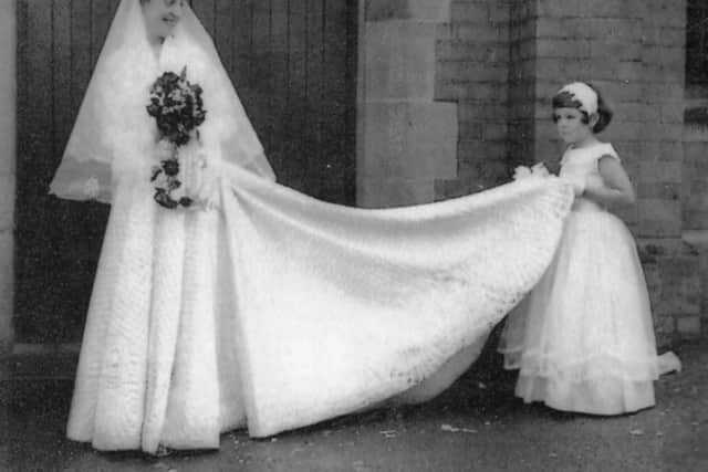 Olive Emms wearing the quilted wedding dress made by her mother in 1957.