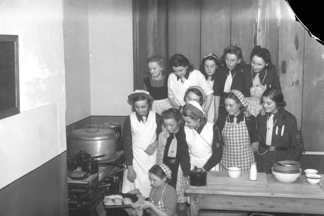 Sunderland Girl Guides - part of a unit attached to Sunderland High School for Girls - engaged in a cookery class at Carlton House Youth Centre in Mowbray Road in 1942.