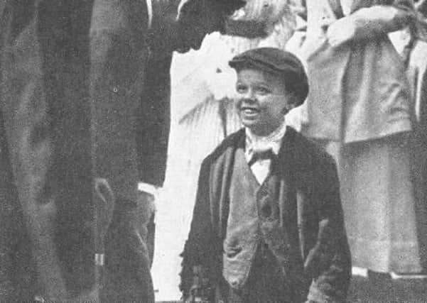 King George V chatting to teenager John Cassidy during a visit to Sunderland's shipyards in 1917. The photo was used in newspapers world-wide.
