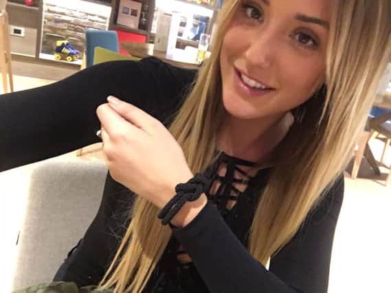 Charlotte wearing her Unity Band