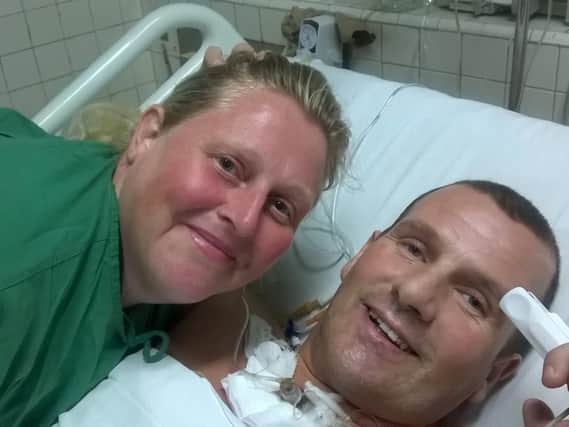 Keith Rochester on the mend in hospital in Cuba with his wife Sharon.
