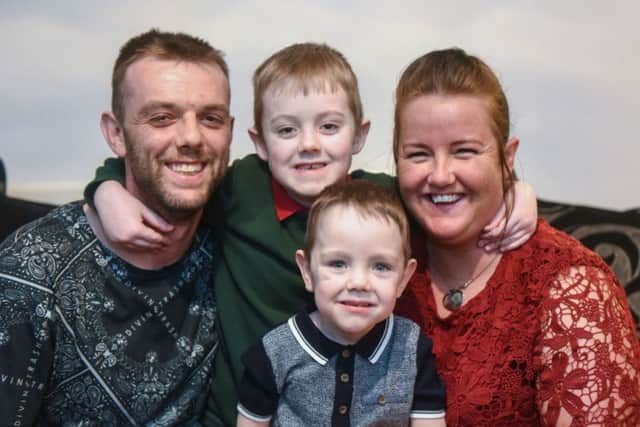 Joseph Gibson pictured with dad Paul, mum Gemma and brother Alfie, six.
