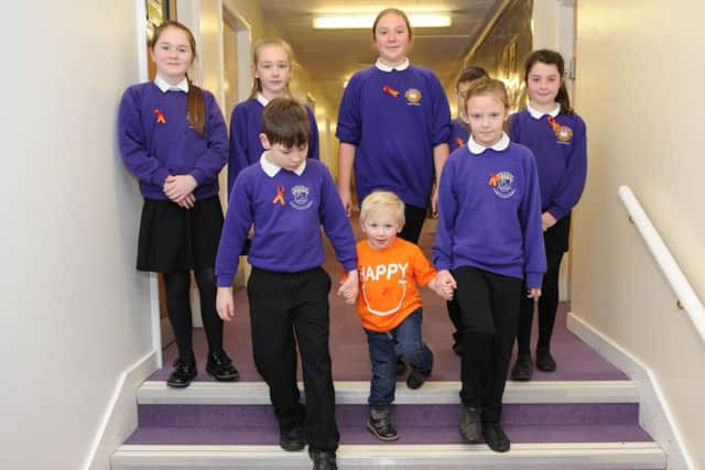 Bexhill Academy pupils made orange ribbons, which were sold to raise funds.