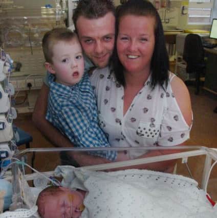 Joseph as a baby at Sunderland Neo-Natal Unit with dad Paul, mum Gemma and brother Alfie.