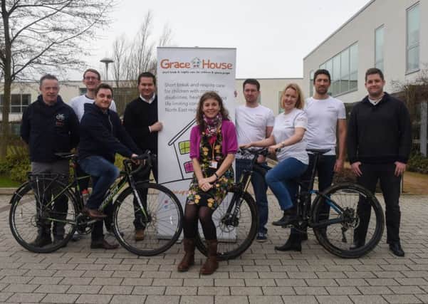 Karen Parry, centre, of Grace House, with staff from Leighton Group, Rainton Bridge, who completed the Coast 2 Coast cycle ride in aid of Grace House, raising Â£4,000.