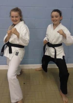 Chelsea Parkin, 12 and Lucy Collins, 9,  from Doxford Park Karate Club, who took their black belt grading.