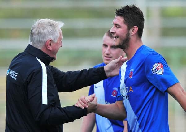 Manager Ronnie Moore congratulates Brad Walker Hartlepool United during their 2-1 away victory over Yeovil Town. Picture by Pinnacle Photo Agency
