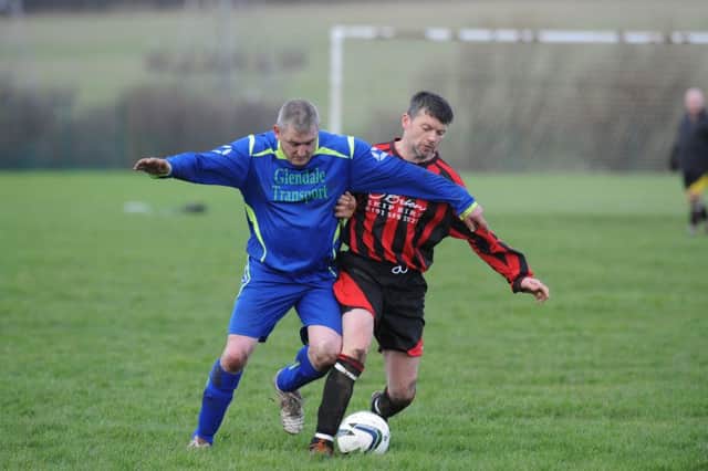 Red House WMC (red strips) battle Steels Kings Bros in the Over-40s League