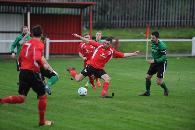 Sunderland RCA's Stephen Callen (red) takes on Sleaford in the FA Vase fourth round. Picture by Tim Richardson