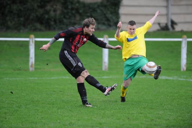 Ashbrooke Belford House (red and black stripes) take on Leam Rangers in the Wearside League. Picture by Tim Richardson