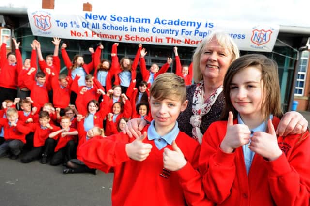 New Seaham Academy year6 pupils Ryan Williamson and Niamh Eltringham join headteacher Bernadette Dolan celebrate the school being the Number One school.