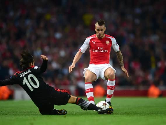 Mathieu Debuchy is more likely to stay at Arsenal, according to Arsene Wenger.