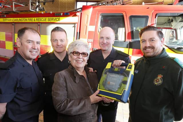 Fire and ambulance staff reunited with Linda Broxson, 68.