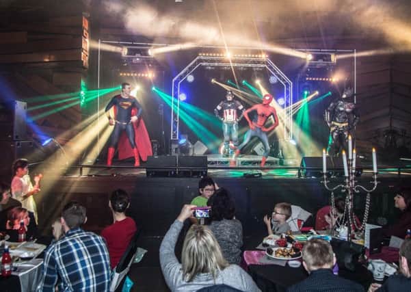 Make My Day superheroes entertain children and their families from Hope 4 Kidz at a special party.