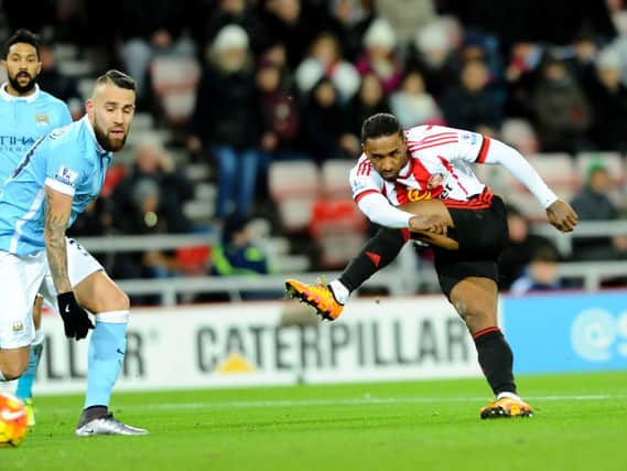 Jermain Defoe gets in a first half shot against Manchester City at The Stadium of Lighyt