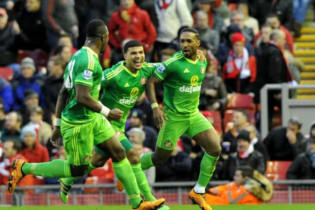 Jermain Defoe celebrates scoring against Liverpool