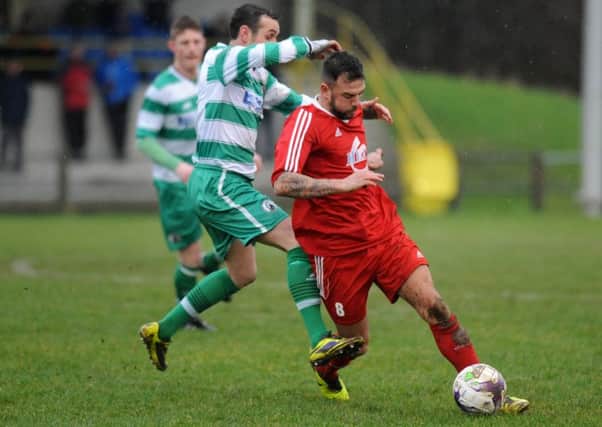 Washington's Chris Wallace battles in last week's win over West Allotment Celtic. Picture by Tim Richardson