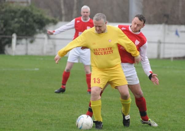 Hylton CW (red) battle Peterlee Helford in the Over-40s League last week. Picture by Tim Richardson