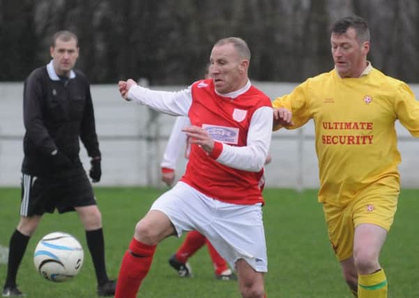 Over-40s League action between Hylton CW (red strip) and Peterlee Helford. Picture by Tim Richardson