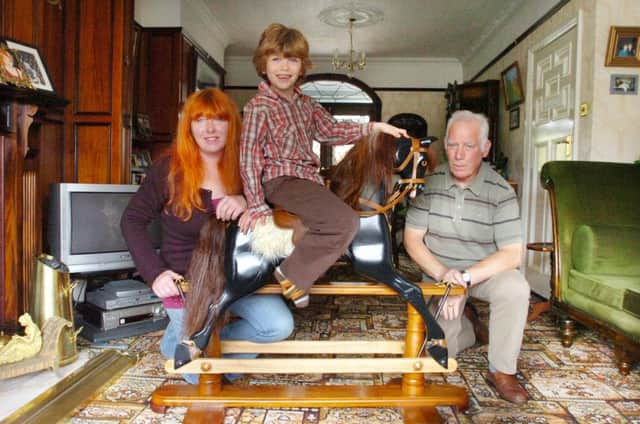 Lesley Cooperwaite and son George Bligh (then 7) with Lesley's father Peter - pictured with the rocking horse Peter made for George.