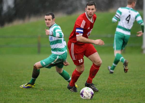 Washington's Mark Davison looks to create an opening in last week's win over West Allotment Celtic