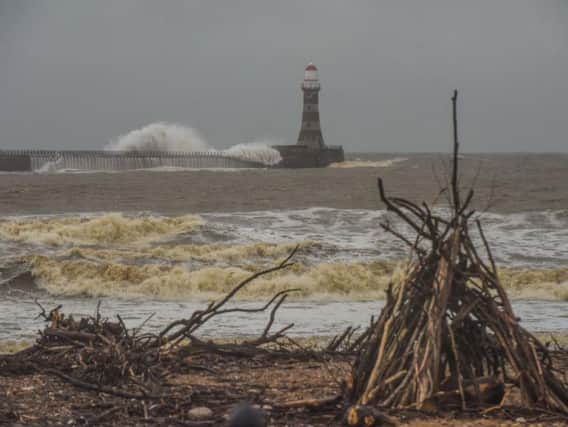 Waves crash over Roker Pier on a previous occasion of high seas.