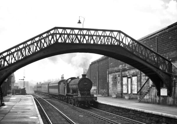 Photograph by Ian S Carr of J39 0-6-0 64919 heading a local passenger train through Monkwearmouth Station in 1957.