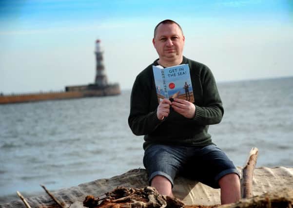 Author Andy Dawson with his book Get In The Sea.