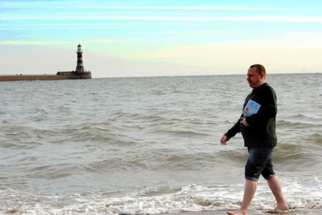 Author Andy Dawson getting in the sea at Roker.