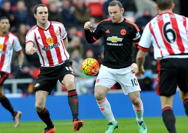 Wayne Rooney in action against Sunderland's John O'Shea